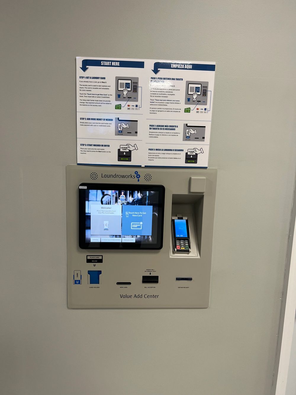 The Value Add Center card kiosk at Clean Sheets with bilingual English and Spanish start-here instructions
